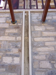Detail showing the stone water channels used instead of plastic guttering.