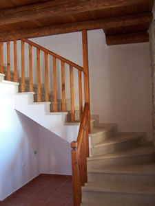Stone stairs and wooden balustrade.