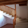 Stone stairs and wooden balustrade.