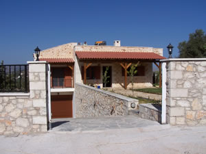 Split level stone villa with boundary wall