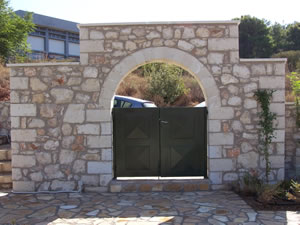 Gate with machine cut stone arch
