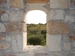 Arched window and exposed stonework