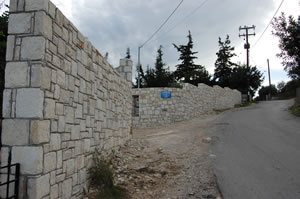 Tall stone boundary wall